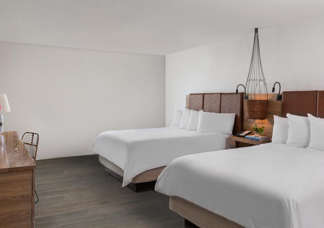 hotel room with two beds at Amara Cay resort