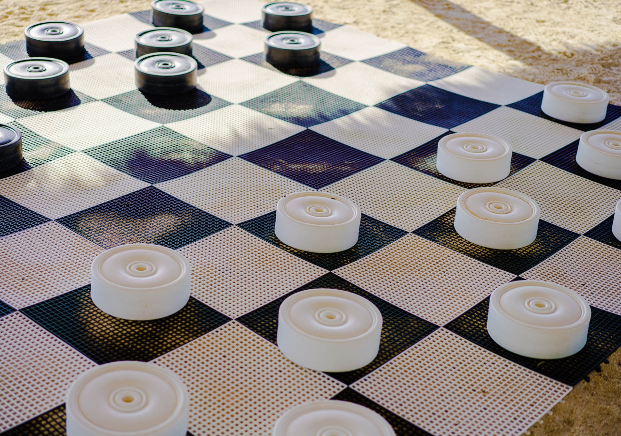 large checkers game on the beach