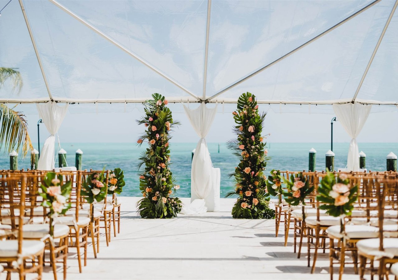 a wedding ceremony set up by the ocean