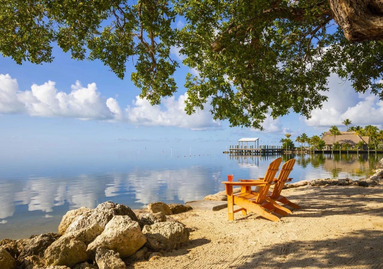 Orange beach chair overlooking the water