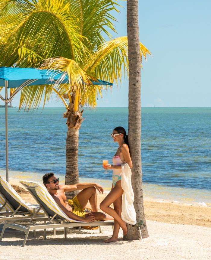 A couple sitting at the beach.