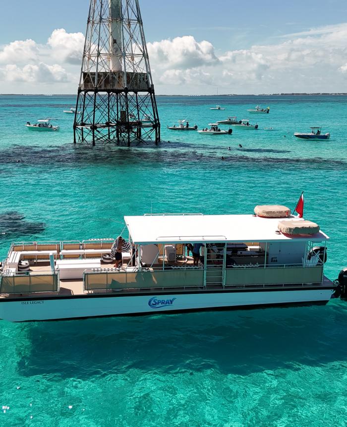 The 55' Isle Legacy boat by Spray Watersports in Islamorada, Florida at the Alligator Reef Lighthouse.