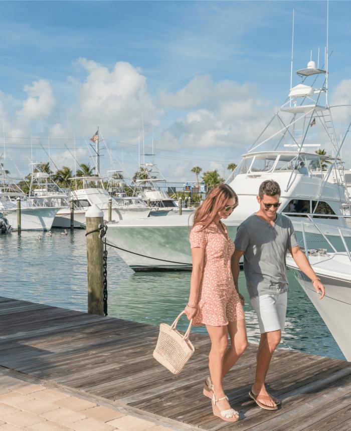 couple walking on the marina boardwalk