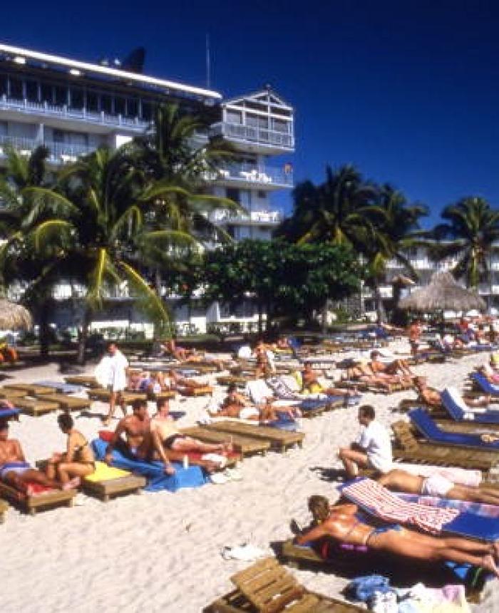 people laying on the beach