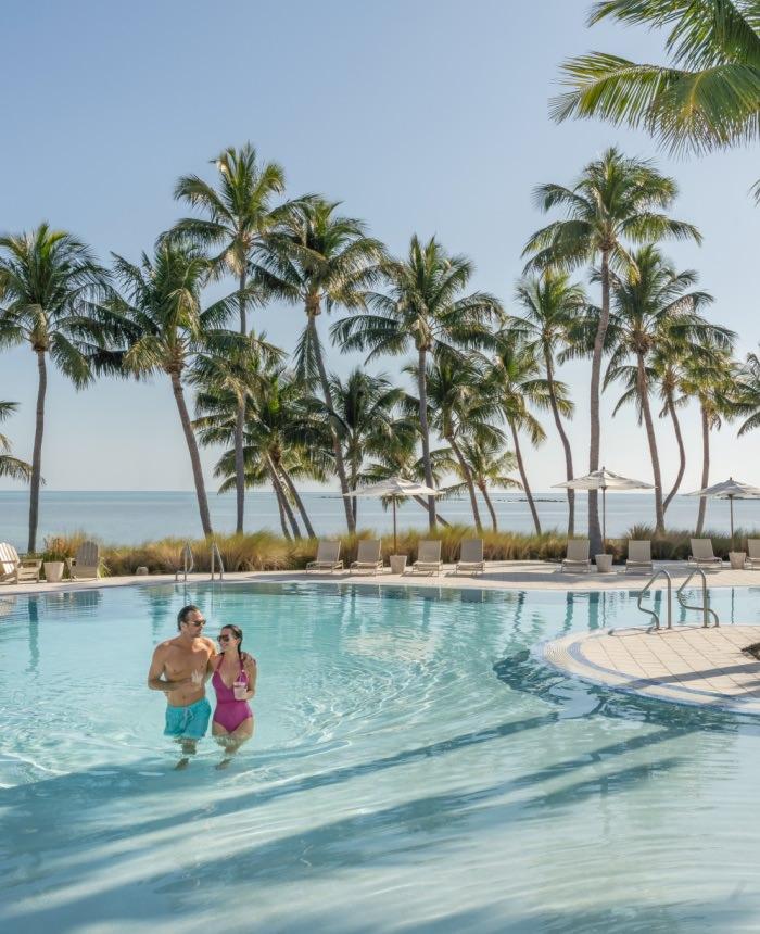 Couple walking in a pool