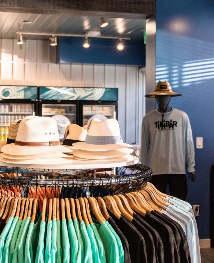 retail store with sun hats and shirts