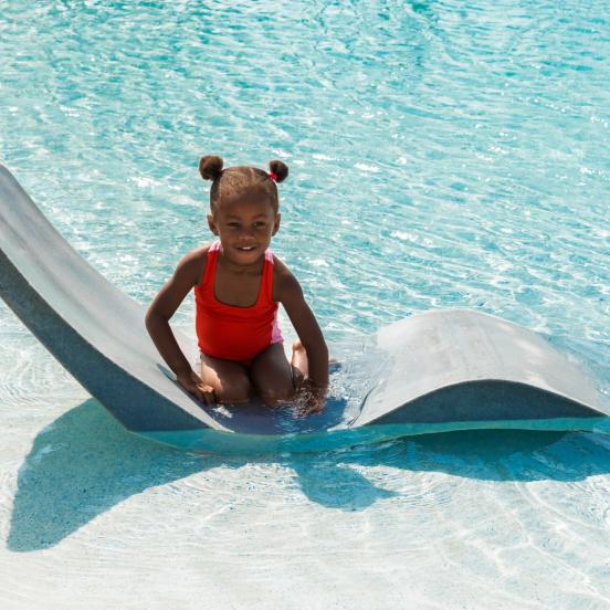 A young girl swimming in the pool at Amara Cay in Islamorada.