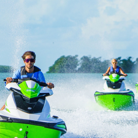 friends riding jetskis