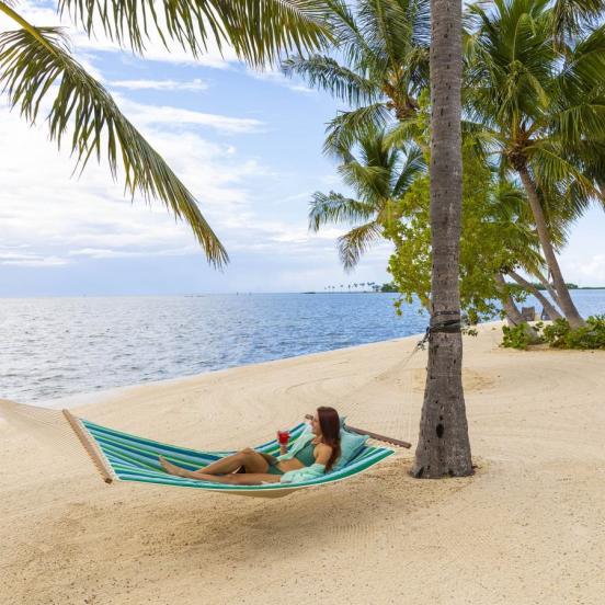 woman in hammock at beach