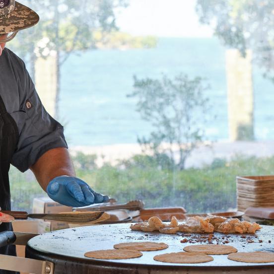 A chef cooking at Helm to Hearth in Islamorada.