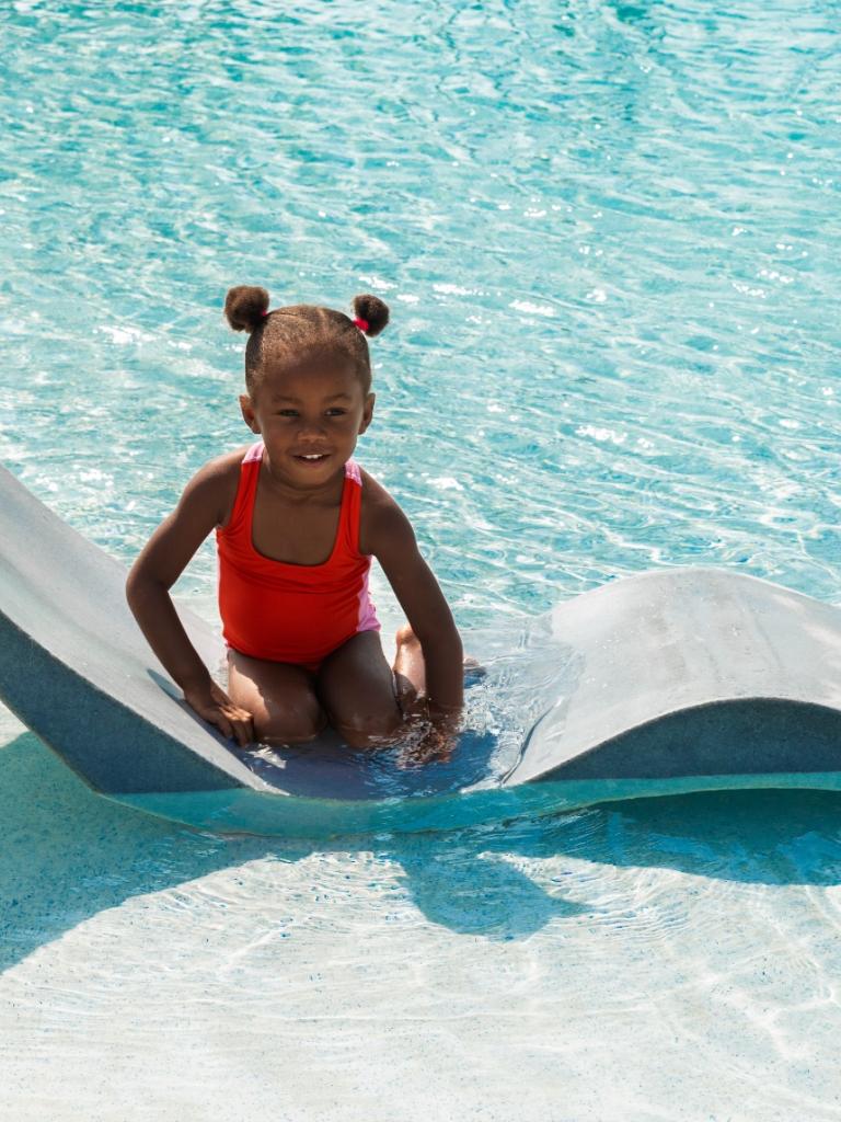 A young girl swimming in the pool at Amara Cay in Islamorada.