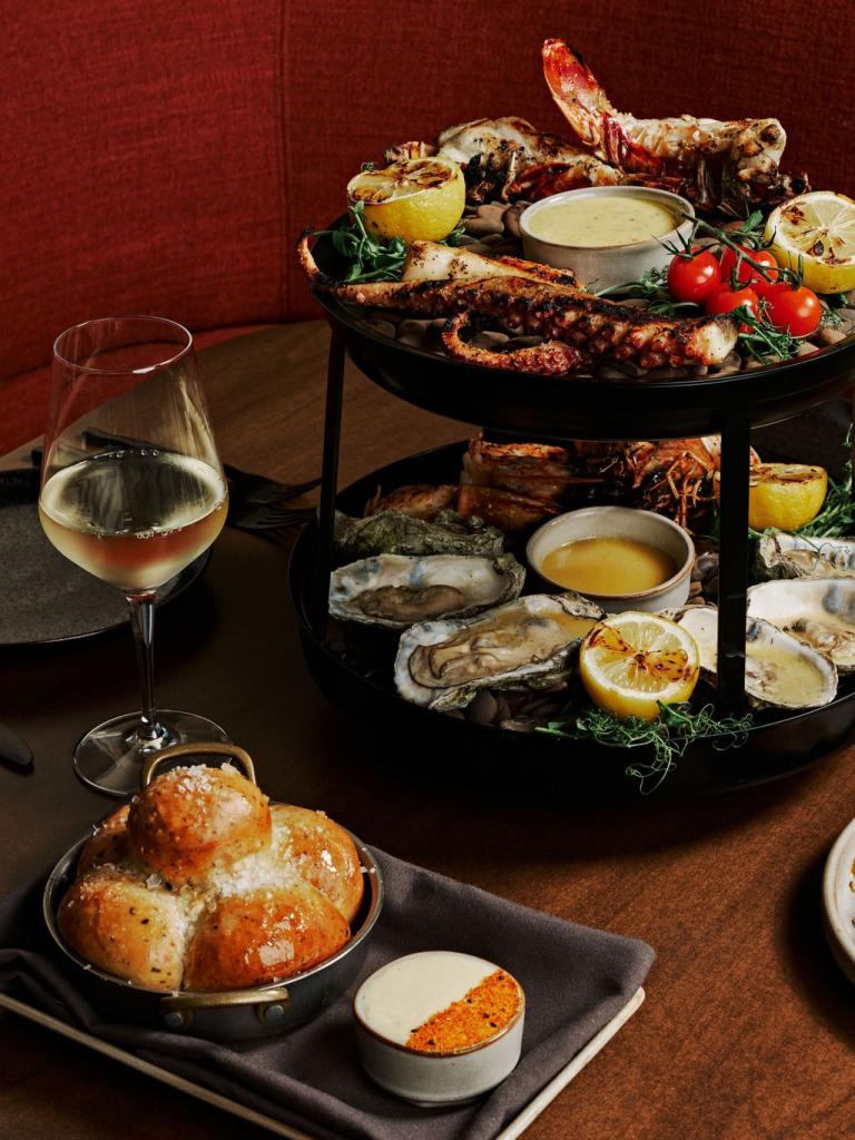 A seafood tower and other various dishes from Kindler