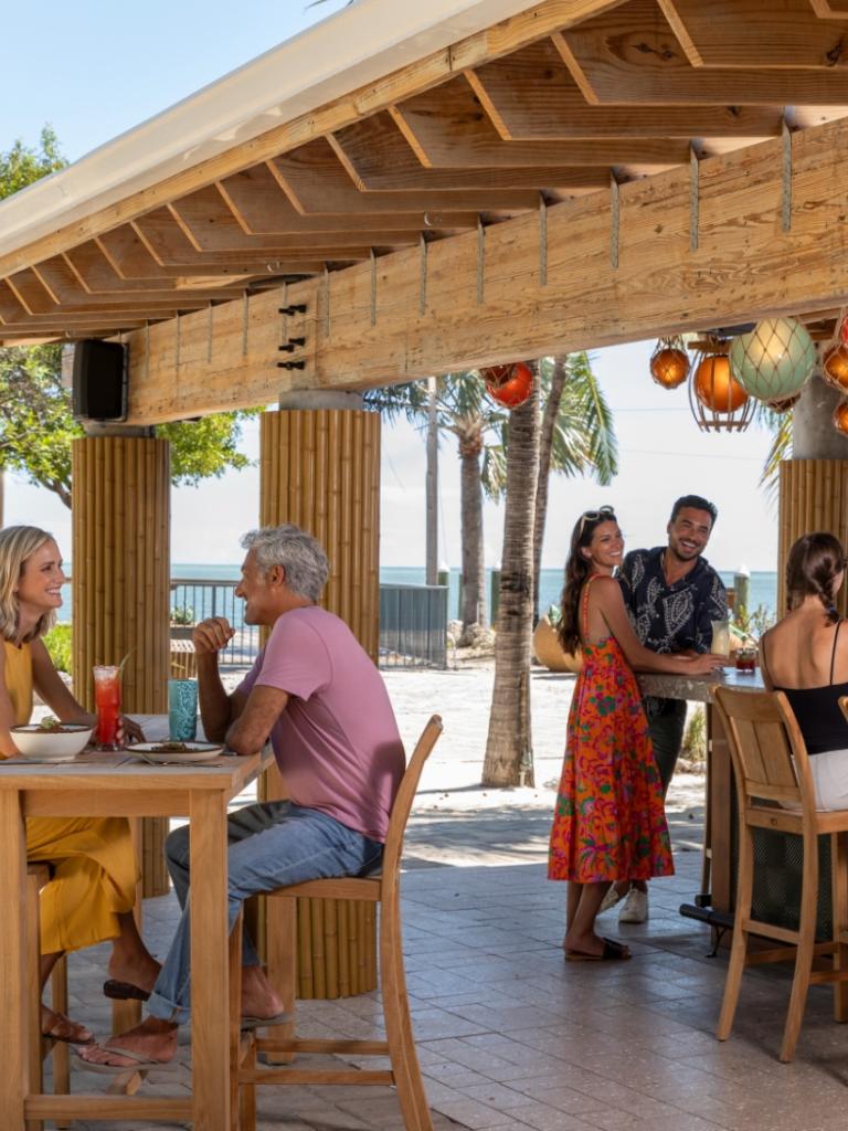 People sitting at the Tiki Bar.