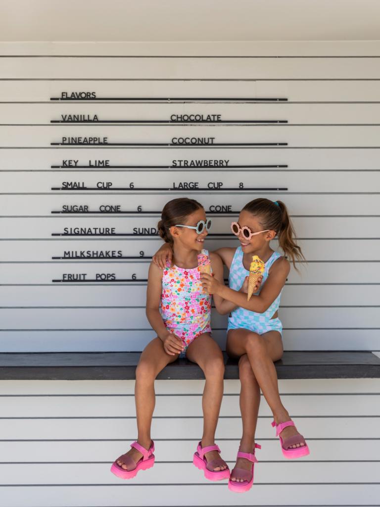 Two girls enjoying ice cream.