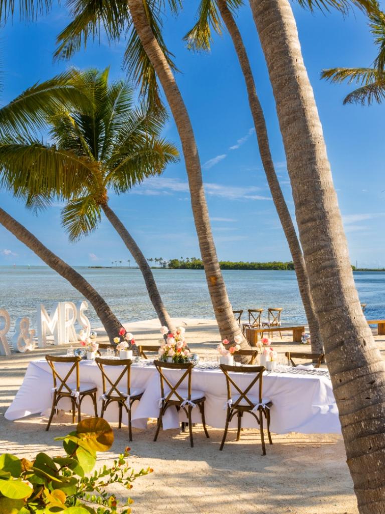 A wedding reception set up on the beach at Amara Cay.