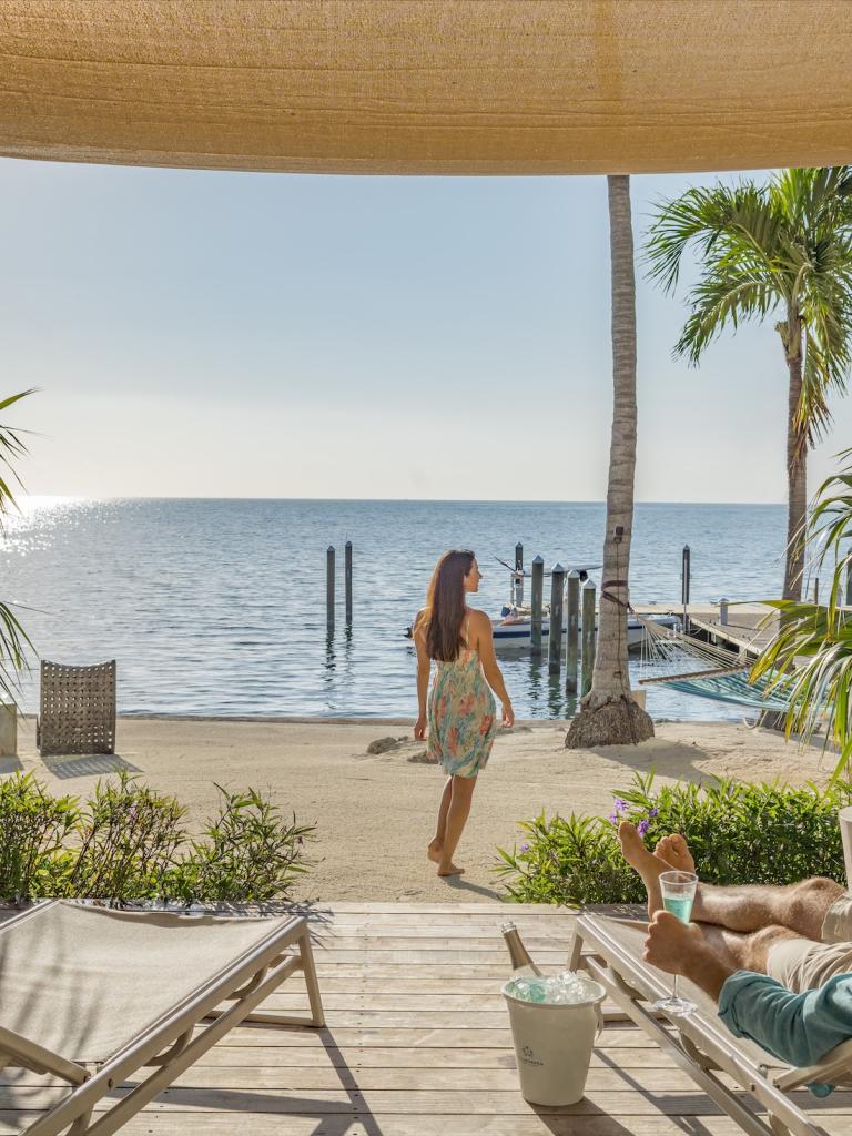 woman walking towards the beach