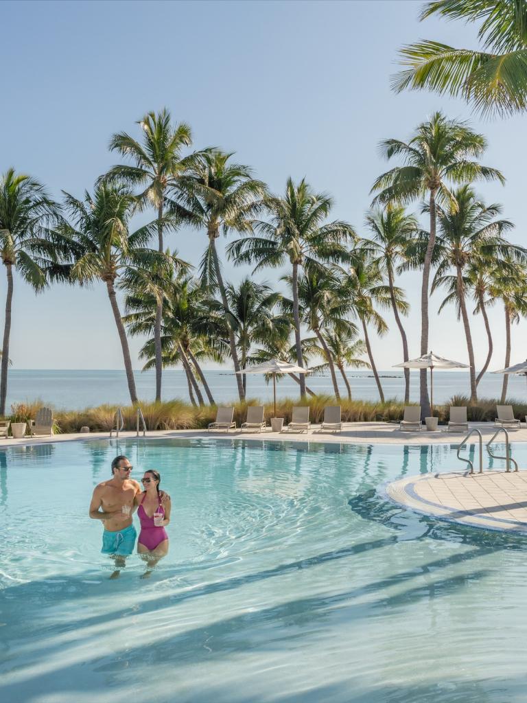 couple walking in a pool