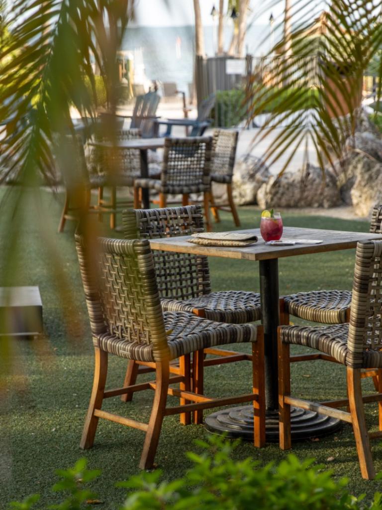 Outdoor seating at ReelCatch, a restaurant at Amara Cay in Islamorada, Florida.