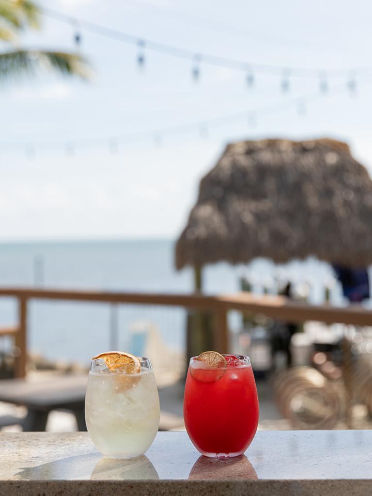Two drinks sitting on the bar overlooking the ocean at La Siesta Resort in the Florida Keys.