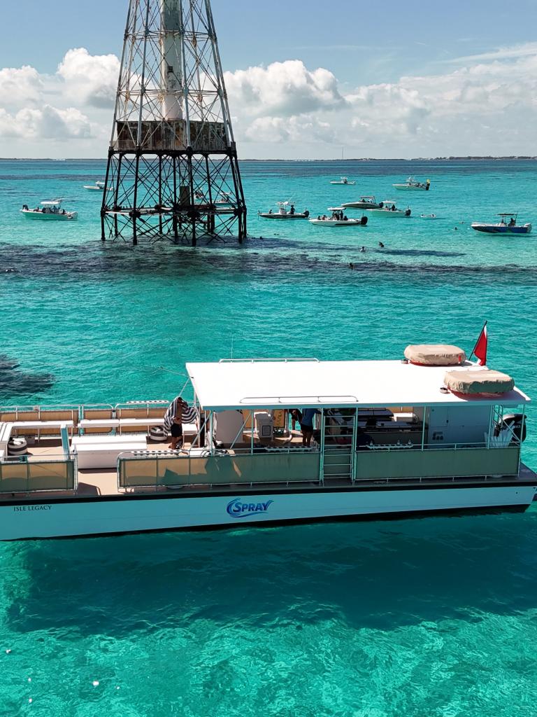 The 55' Isle Legacy boat by Spray Watersports in Islamorada, Florida at the Alligator Reef Lighthouse.