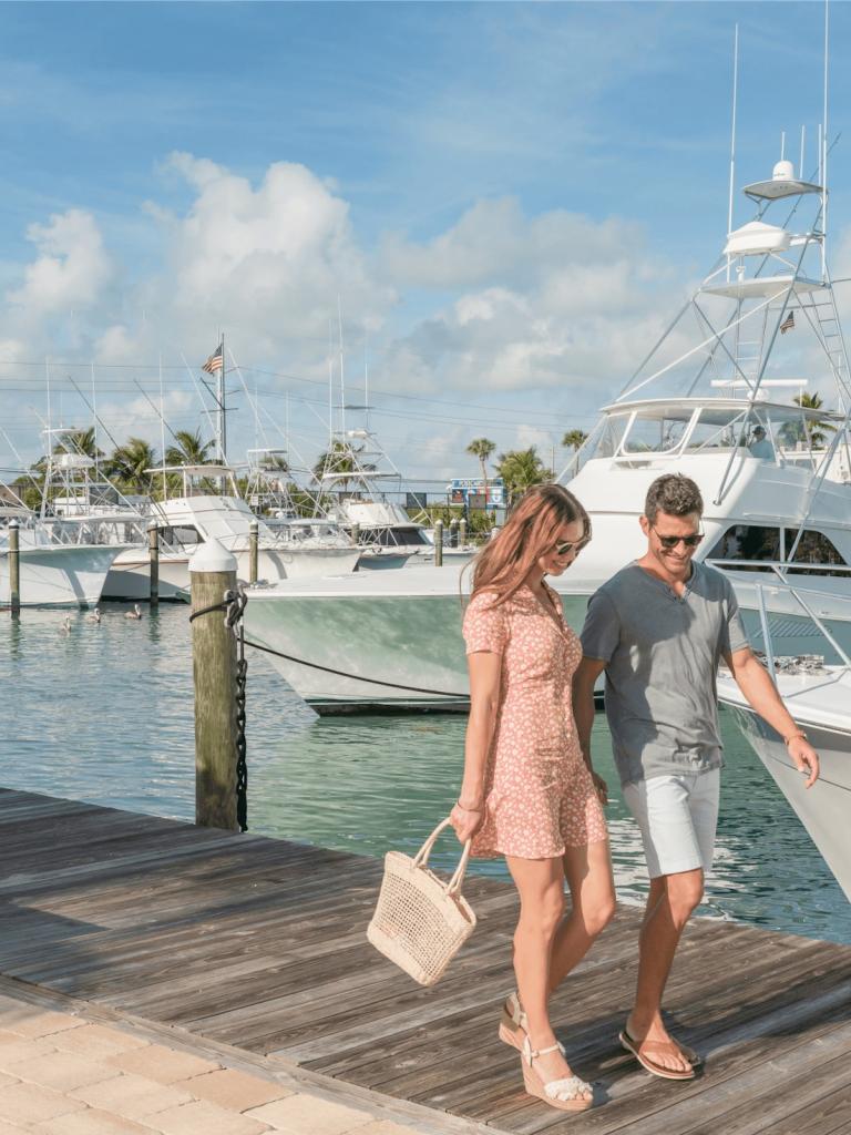 couple walking on the marina boardwalk