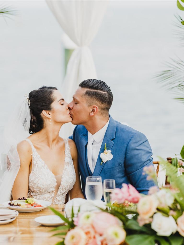 bride and groom kissing during reception