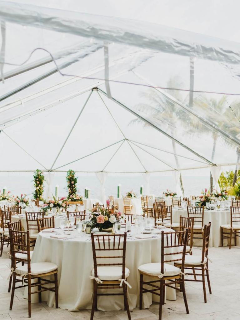 a wedding set up with a tent and tables