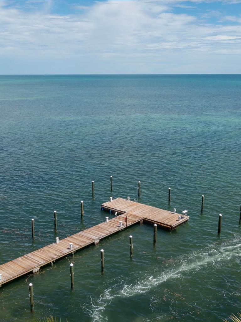 Aerial shot of La Siesta marina with a boat in the water