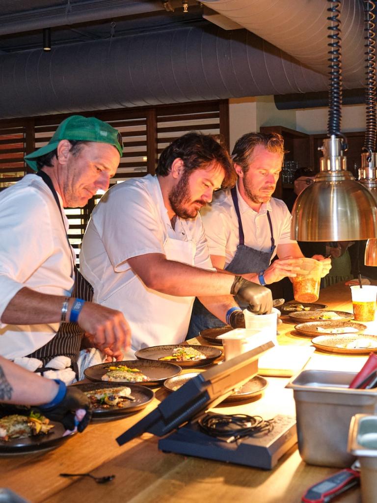 Chefs cooking at Kindler during Helm to Hearth.