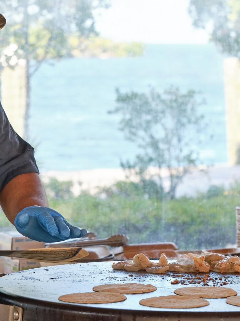 A chef cooking at Helm to Hearth in Islamorada.