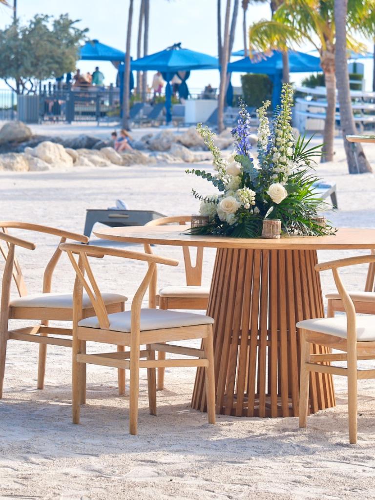 Table and chairs set up outside at Helm to Hearth.