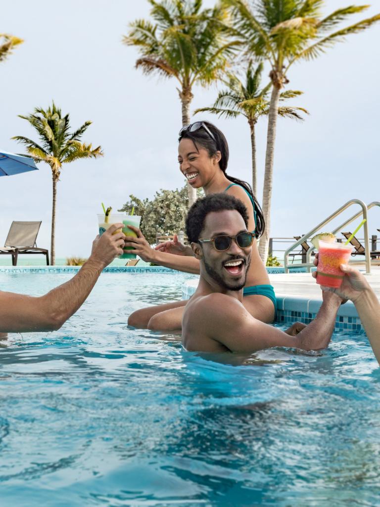 People enjoying drinks in a pool