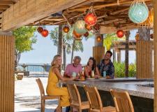 People sitting at the Tiki Bar.