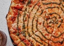 A close up of a cheese pizza.
