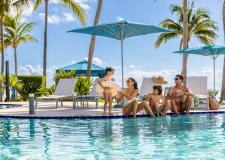 A family sitting by the pool.