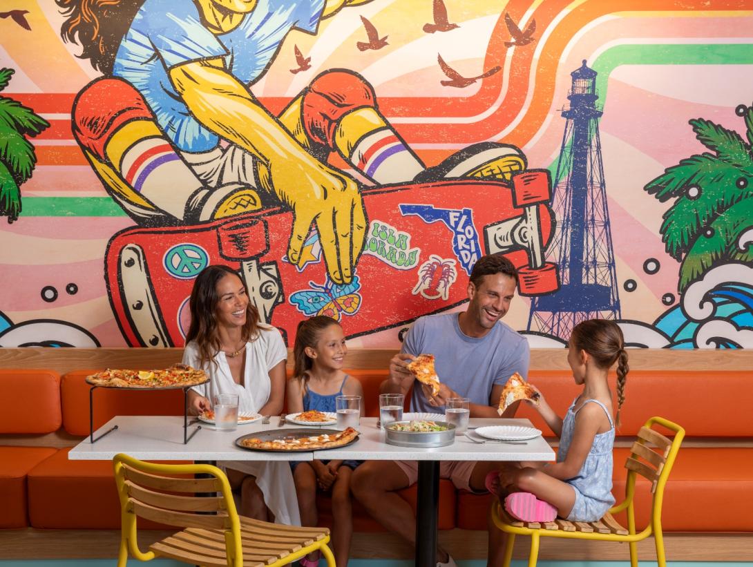 A family enjoying pizza at Islamorada Pizza Co.
